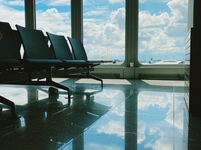 Sunlight streaming through large windows in a fitness room.